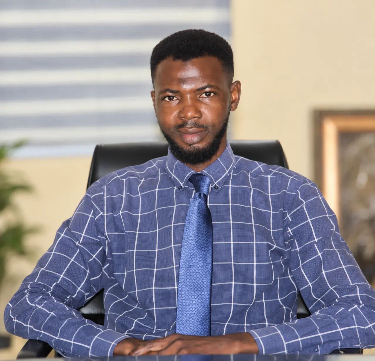 Male team member in a formal office portrait