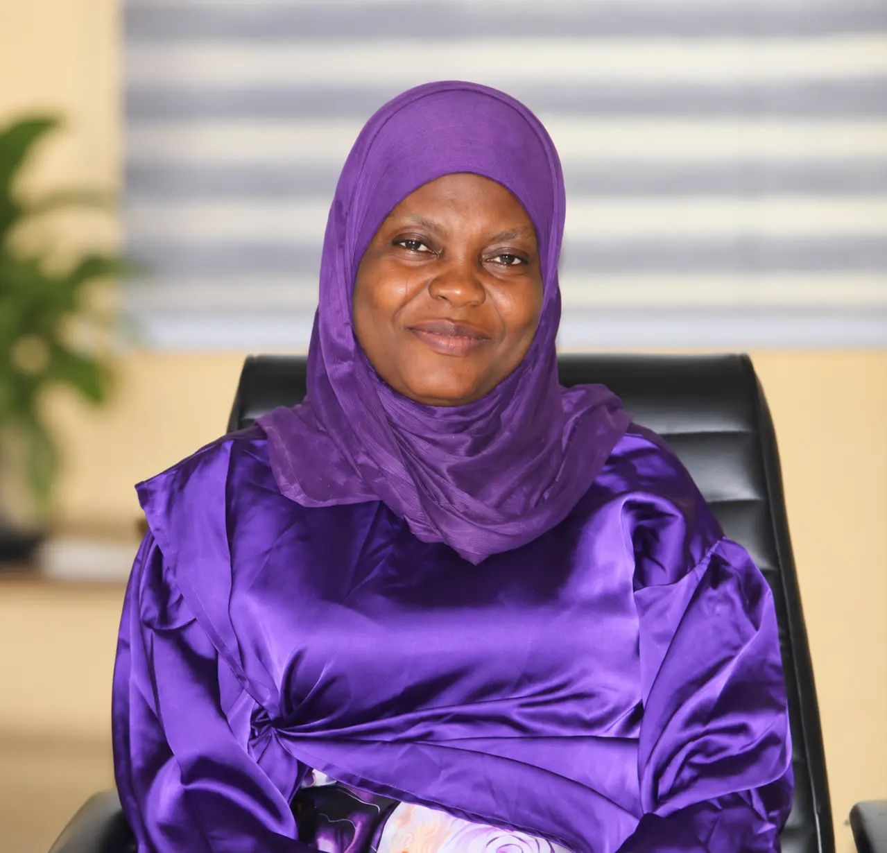 Senior female administrative professional seated in the chambers